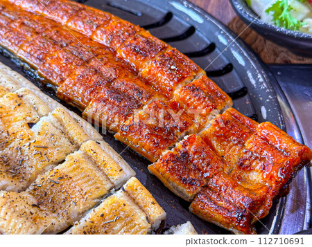 Korean food. Grilled eel grilled salt and seasoned Korean food. Grilled eel grilled salt and seasoned 112710691