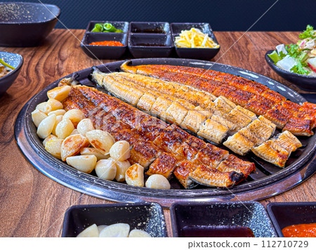 Korean food. Grilled eel grilled salt and seasoned Korean food. Grilled eel grilled salt and seasoned 112710729