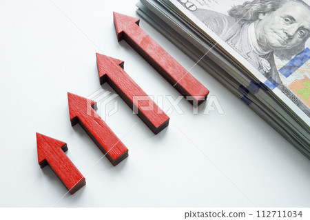 Growing graph of arrows and cash as a symbol of personal savings and income. Growing graph of arrows and cash as a symbol of personal savings and income. 112711034