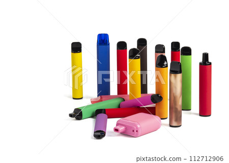Set of colorful disposable electronic cigarettes of different shapes on a white background. The concept of modern smoking. Set of colorful disposable electronic cigarettes of different shapes on a white background. The concept of modern smoking. 112712906