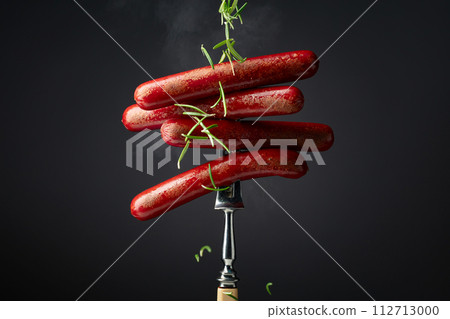Grilled sausages sprinkled with rosemary. 112713000