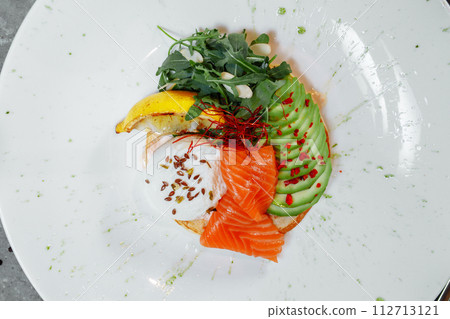 Summer healthy fastfood lunch, breakfast with Pancake with red fish, avocado and egg for breakfast. Aesthetic still life, healthy food concept 112713121