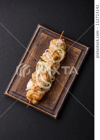 Delicious fresh chicken meat kebab with salt, spices and herbs 112713142