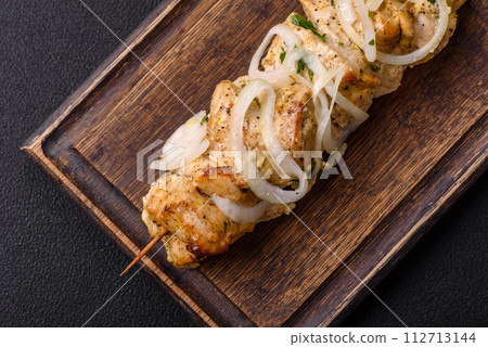 Delicious fresh chicken meat kebab with salt, spices and herbs 112713144