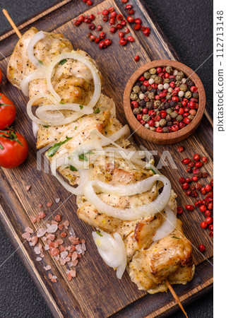 Delicious fresh chicken meat kebab with salt, spices and herbs Delicious fresh chicken meat kebab with salt, spices and herbs 112713148