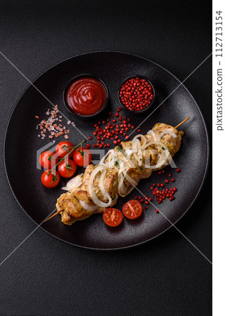 Delicious fresh chicken meat kebab with salt, spices and herbs Delicious fresh chicken meat kebab with salt, spices and herbs 112713154