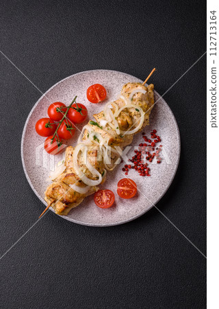 Delicious fresh chicken meat kebab with salt, spices and herbs 112713164