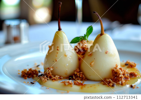 Paleo style dessert poached pear dessert pashot. Pear caramelized in syrup on a wooden plate Paleo style dessert poached pear dessert pashot. Pear caramelized in syrup on a wooden plate 112713341