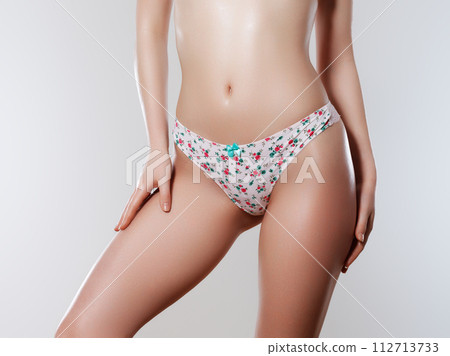 Tanned woman in top form, perfect body shape Tanned woman in top form, perfect body shape 112713733