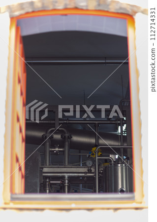 View from the outside through the window of the equipment and industrial tools for the production of brewery. View from the outside through the window of the equipment and industrial tools for the production of brewery. 112714331