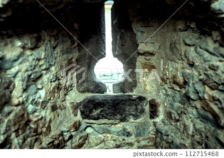 light bulb on stone wall light bulb on stone wall 112715468