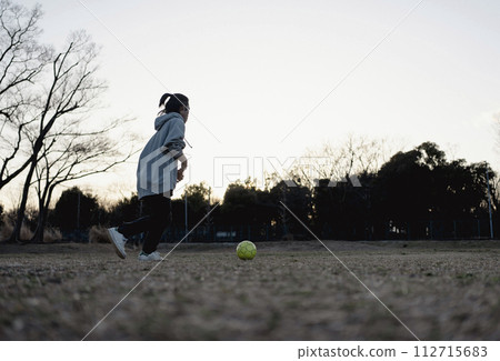 Children enjoying soccer until dusk 112715683