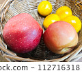 apples and oranges in a basket 112716318