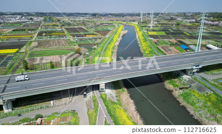 "Saitama Prefecture" Spring scenery of Minuma rice fields near Niiminumuma Ohashi Bridge seen from a drone 112716625