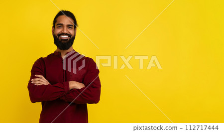 Positive millennial eastern man smiling at camera, copy space 112717444
