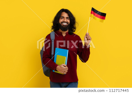 Positive eastern young man studying German at university 112717445
