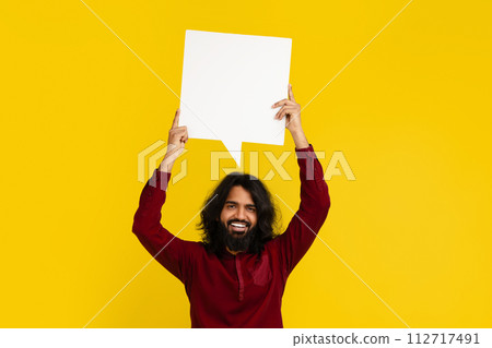 Indian man holding speech bubble with empty space Indian man holding speech bubble with empty space 112717491
