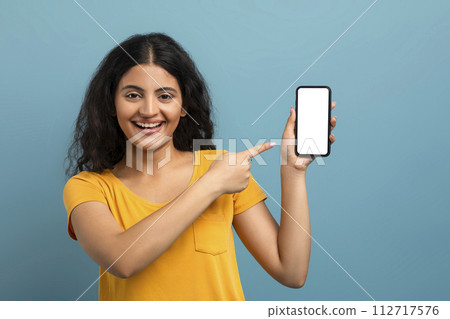 Woman showing smartphone screen 112717576