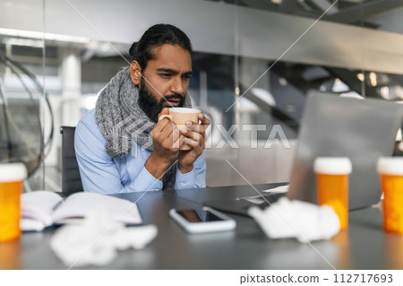 Man feeling ill at work Man feeling ill at work 112717693
