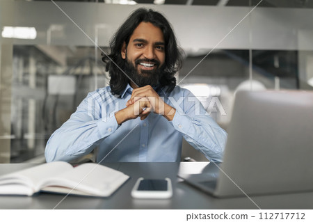 Happy man in office posing for photo Happy man in office posing for photo 112717712
