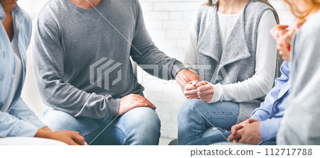 Depressed addicted woman sharing her problems at group meeting Depressed addicted woman sharing her problems at group meeting 112717788