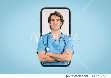 Smiling male nurse in blue scrubs inside smartphone frame with crossed arms Smiling male nurse in blue scrubs inside smartphone frame with crossed arms 112717836