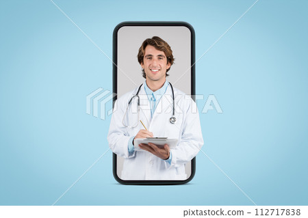 Positive male doctor therapist in white coat using tablet, on big phone screen, isolated on blue background, studio Positive male doctor therapist in white coat using tablet, on big phone screen, isolated on blue background, studio 112717838