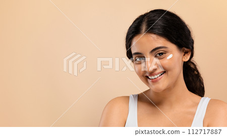 Portrait Of Attractive Young Indian Woman With Cream On Face Portrait Of Attractive Young Indian Woman With Cream On Face 112717887