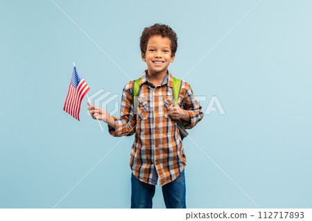 Patriotic boy with flag, plaid shirt, smiling Patriotic boy with flag, plaid shirt, smiling 112717893