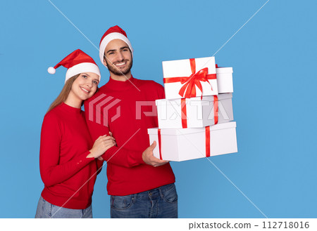 Christmas Presents. Happy Young Couple With Gift Boxes In Hands 112718016