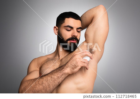 Middle Eastern Man Applying Deodorant Antiperspirant On Armpit 112718465