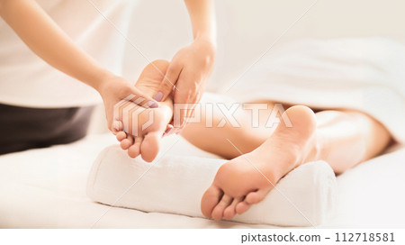 Acupressure And Reflexology Concept. Masseur Doing Foot Massage Acupressure And Reflexology Concept. Masseur Doing Foot Massage 112718581
