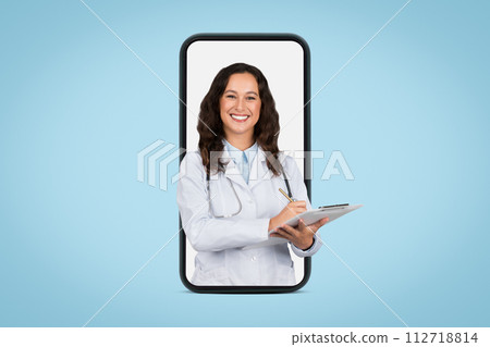 Cheerful young doctor woman with stethoscope and clipboard writing prescription to patient, huge phone screen 112718814