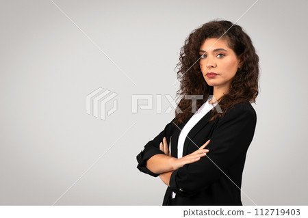 Confident professional european woman with arms crossed Confident professional european woman with arms crossed 112719403