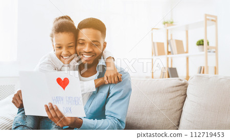 Happy father's day. Daughter congratulating dad at home 112719453