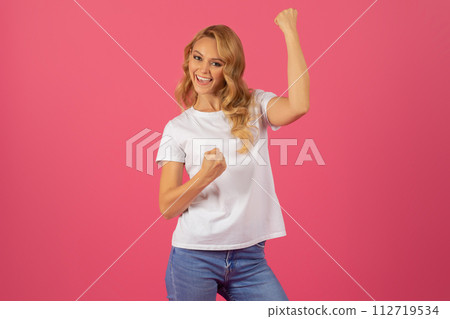 Attractive blonde lady expressing joy and success gesturing yes, studio 112719534