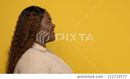 Side view of black lady looking at copy space 112719577