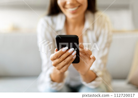 Shopping Online. Young Smiling Lady Using Smartphone At Home 112720017