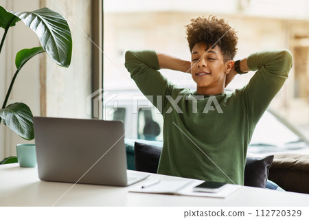 Joyful african american guy entrepreneur enjoying results of his job 112720329