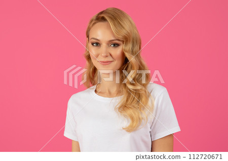 Portrait of pretty blonde young lady looking with cute smile Portrait of pretty blonde young lady looking with cute smile 112720671