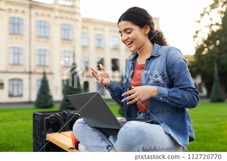 Eastern Woman Student Video Calling Via Laptop Having Virtual Lecture Eastern Woman Student Video Calling Via Laptop Having Virtual Lecture 112720770