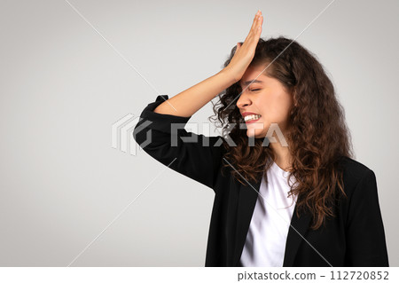 Frustrated woman with facepalm gesture Frustrated woman with facepalm gesture 112720852