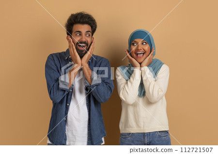 Great Deal. Amazed Muslim Spouses Looking At Each Other And Touching Face Great Deal. Amazed Muslim Spouses Looking At Each Other And Touching Face 112721507