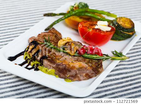 Veal with baked vegetables is tasty dish Veal with baked vegetables is tasty dish 112721569