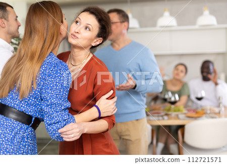 Two women greet each other when meeting 112721571