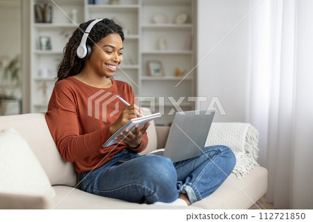 Online Education. Black Woman In Headphones Study With Laptop Computer At Home Online Education. Black Woman In Headphones Study With Laptop Computer At Home 112721850