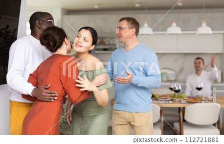 Group of friends greeting each other Group of friends greeting each other 112721881