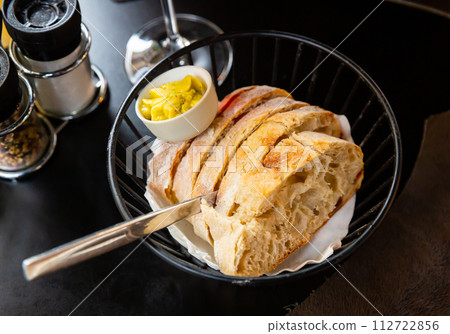 Slices of home baked white bread and fresh butter Slices of home baked white bread and fresh butter 112722856