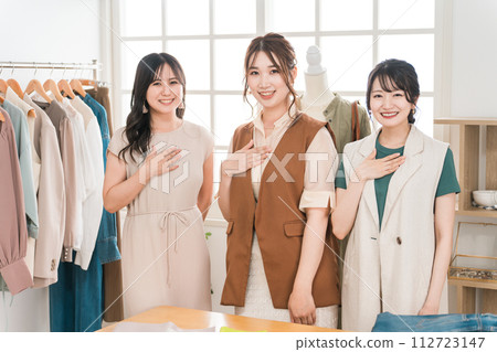 Women working in textile designers, fashion designers, pattern makers, stylists, and apparel. Women working in textile designers, fashion designers, pattern makers, stylists, and apparel. 112723147