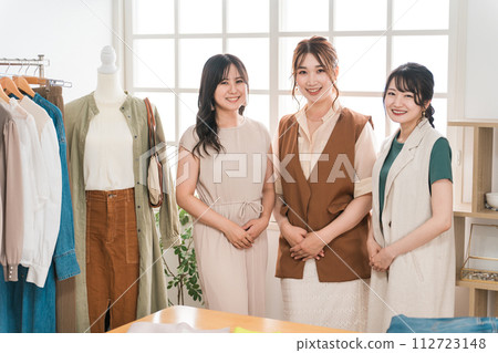 Women working in textile designers, fashion designers, pattern makers, stylists, and apparel. 112723148